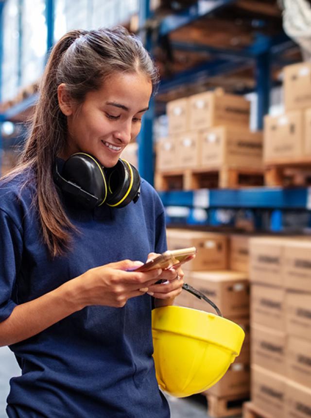 warehouse-employee-uses-mobile-phone-in-warehouse-short-codes-program